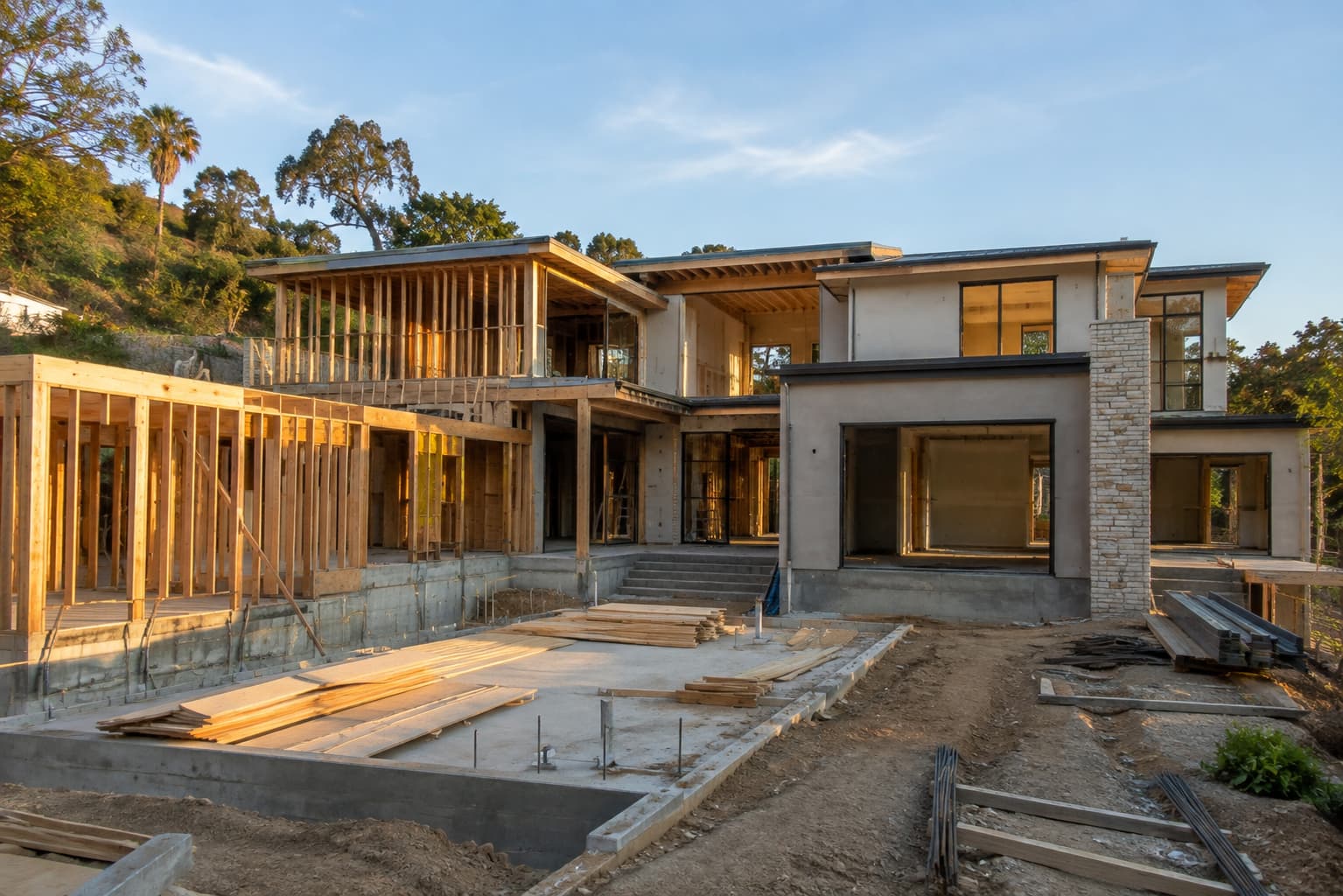 Custom home construction stages from foundation through interior finishing